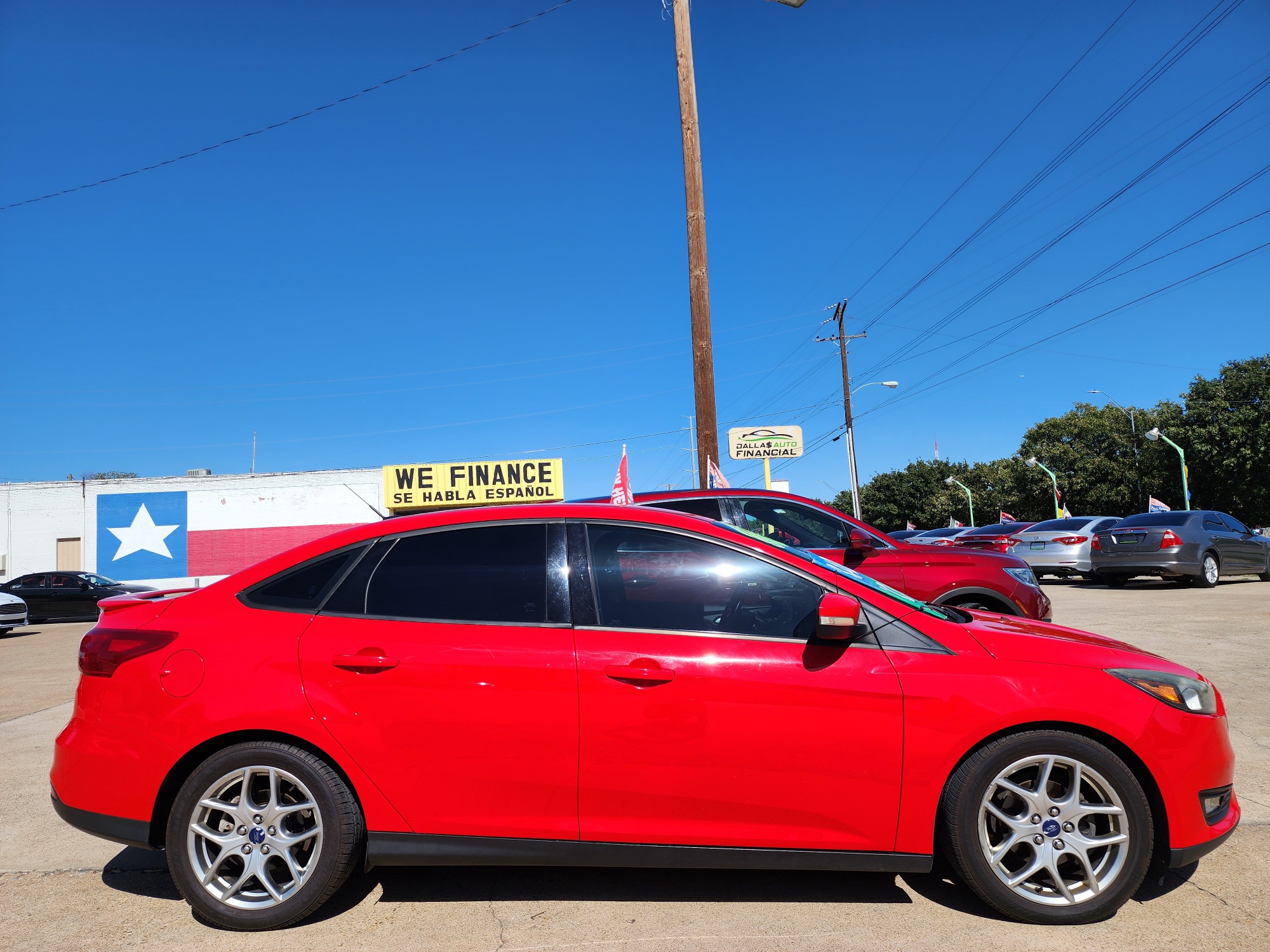 2015 RED Ford Focus SE (1FADP3F22FL) , AUTO transmission, located at 2660 S.Garland Avenue, Garland, TX, 75041, (469) 298-3118, 32.885551, -96.655602 - Welcome to DallasAutos4Less, one of the Premier BUY HERE PAY HERE Dealers in the North Dallas Area. We specialize in financing to people with NO CREDIT or BAD CREDIT. We need proof of income, proof of residence, and a ID. Come buy your new car from us today!! This is a Super Clean 2015 FORD FOCUS - Photo #2
